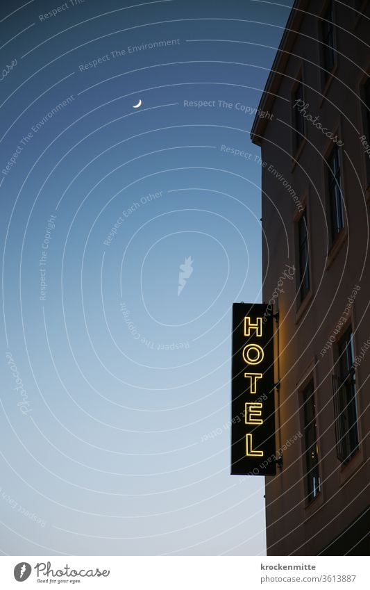 Hotel - illuminated letters on the hotel facade. Night sky with moon. lettering Illuminated letter neon sign Window Crescent moon Exterior shot Evening