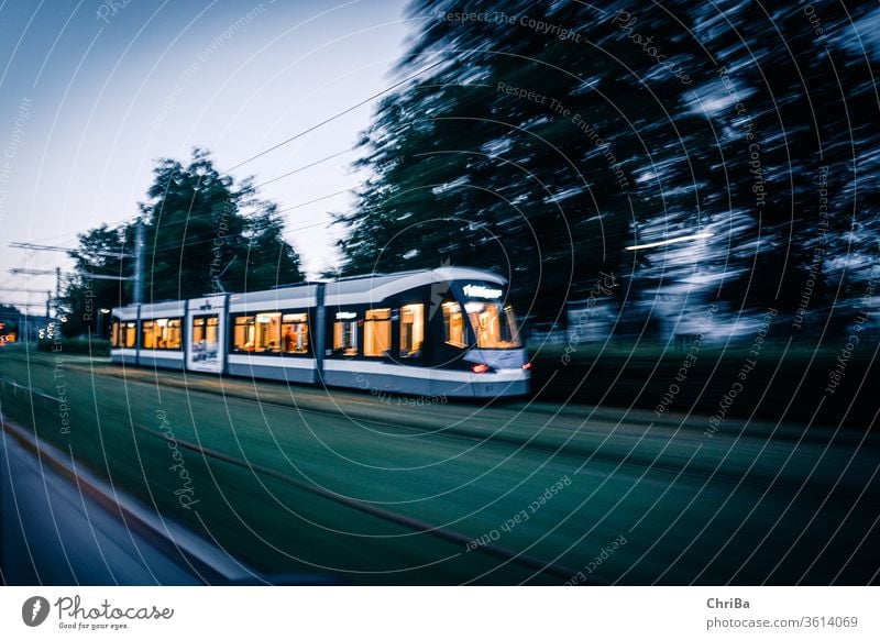 Tram in the twilight Town Road traffic Driving Traffic infrastructure Speed Reaction Evening Artificial light Low-key Long exposure Motion blur Mobility