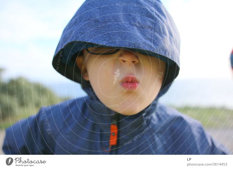 child with a hood over his eyes Hooded (clothing) Portrait photograph Looking Face Human being Facial expression Eyes Eyeglasses angry Blind Blindfold