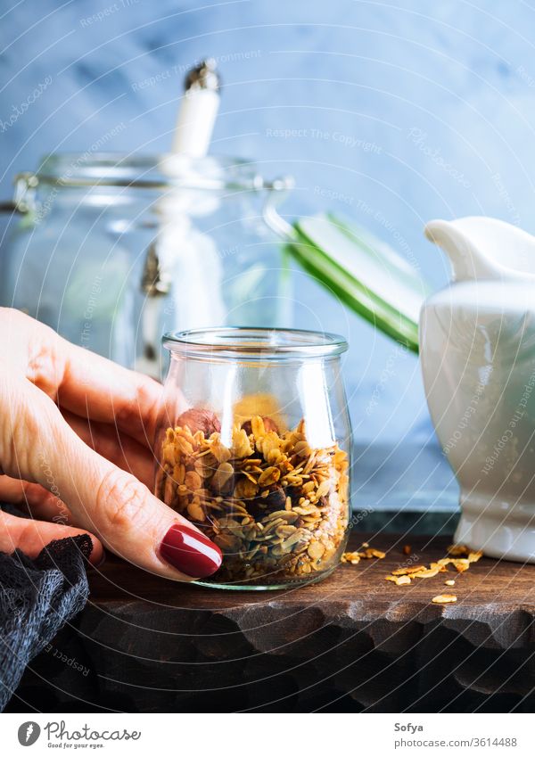 Homemade granola with honey and chestnuts homemade muesli breakfast diet food healthy glass background cereal snack blue natural nutrition organic grain sweet