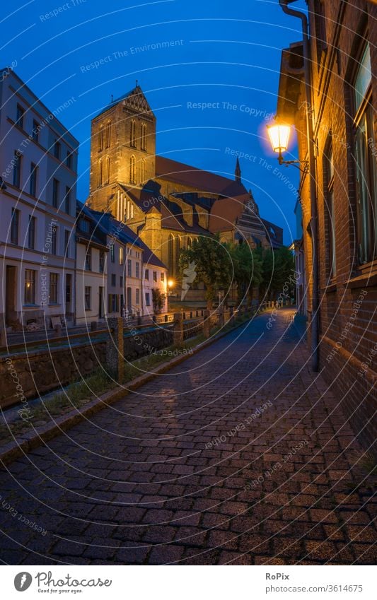 Wismar at the blue hour. Church Night Alley Street Old town urban Medieval times medieval Night life pavement Paving stone church sacral building house of God