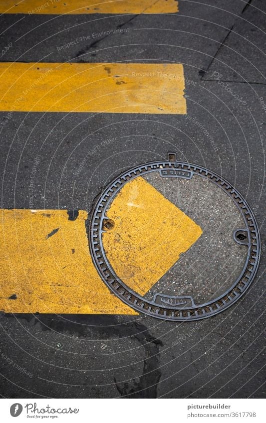 Zebra crossing and manhole cover Street Manhole cover Road marking attentiveness incorrect road surface Yellow Gray Offset Bird's-eye view Asphalt Metal