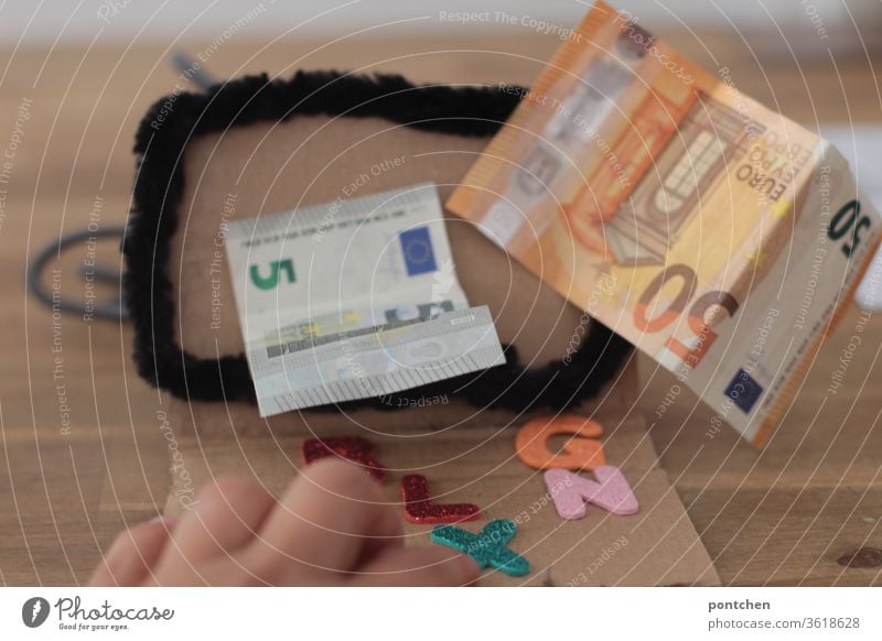Online banking. Earn money from your computer. Banknotes 5 euros and 50 euros come out of a computer screen. Money Bank note Luxury bank account Economy