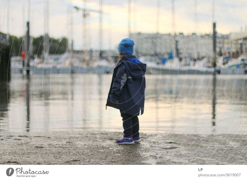 boy on the shore of a water looking away Looking Horizon Future Hope Looking away Hopelessness Faith & Religion Separate Belief Light Adults Human being Water