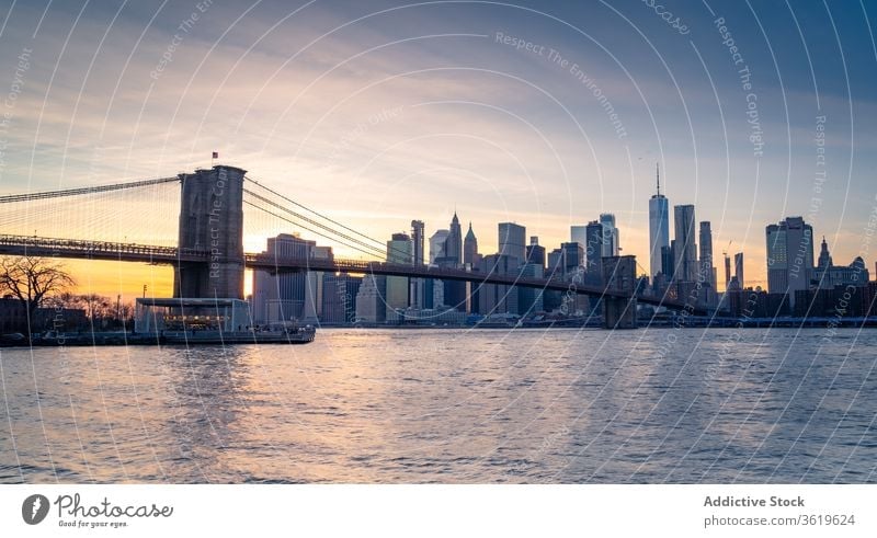 Modern cityscape with bridge over river new york skyline skyscraper building brooklyn modern architecture urban district downtown famous landmark water