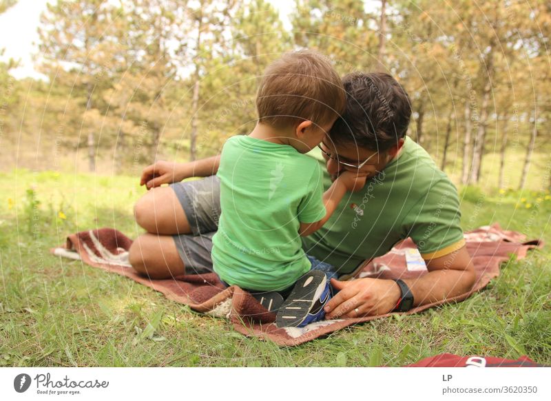 child holding father's head Parenting parenthood Parental care Parent with child parental leave Adults Parents Education Love Affection Child Family & Relations