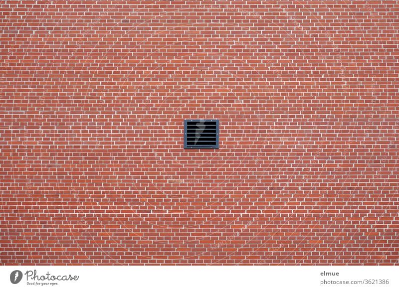 small square, black ventilation window in a red façade based on the brick construction Ventilation windows Wall (building) Facade Brick construction
