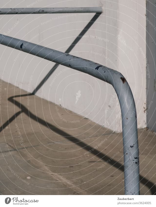 The shadow of a grey iron bar casts lines on walls and pavement pole Shadow Gray Iron Street Wall (barrier) Concrete White Pattern Abstract stop Grasp Curve