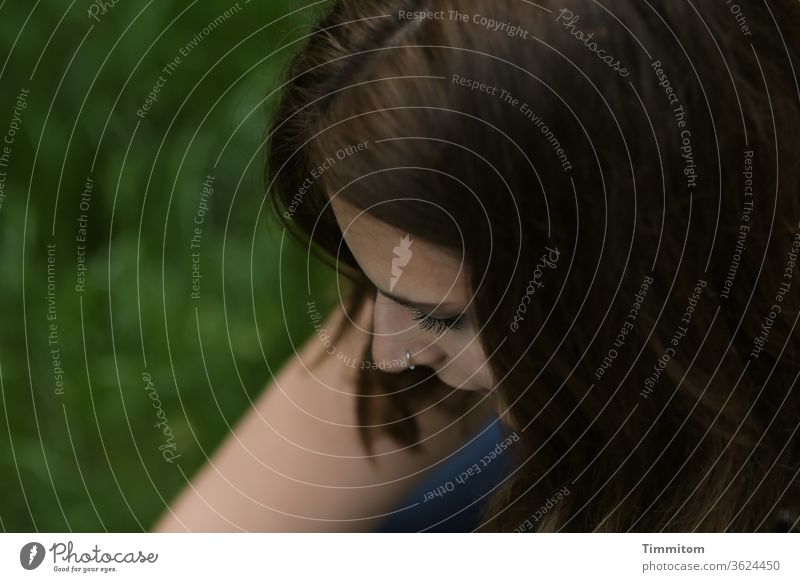 In your thoughts... Woman Young woman Face hair arm Meadow Grass tranquillity lost in thought Pensive Meditative portrait Feminine pretty Emotions Authentic