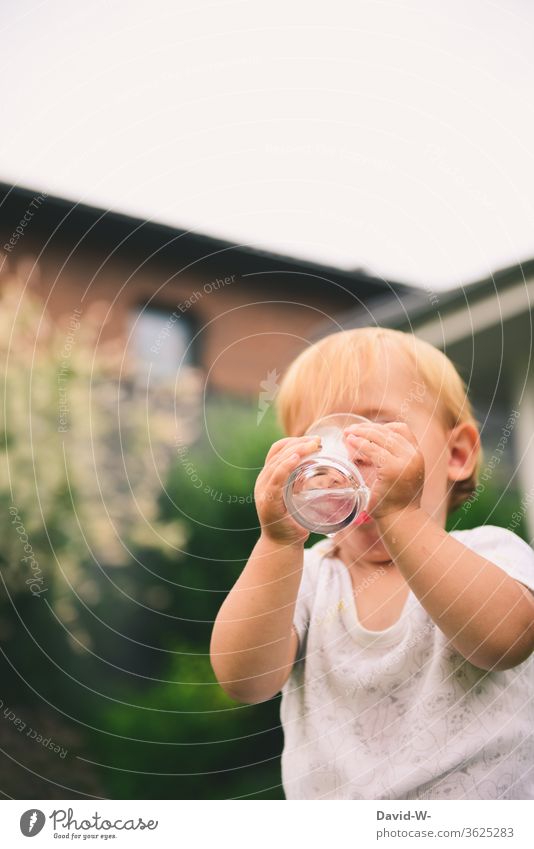 a thirsty child outside drinking water from a glass Child drinks Drinking Boy (child) Thirst Thirsty Summer Summery Hot Thirst-quencher Beverage Cold drink