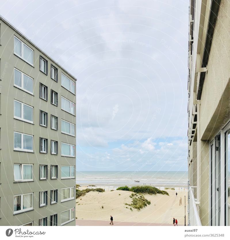 View through a canyon of houses on a sandy beach gorge of houses Beach Belgium added Built-in sand dune To go for a walk Ocean Coast North Sea Water