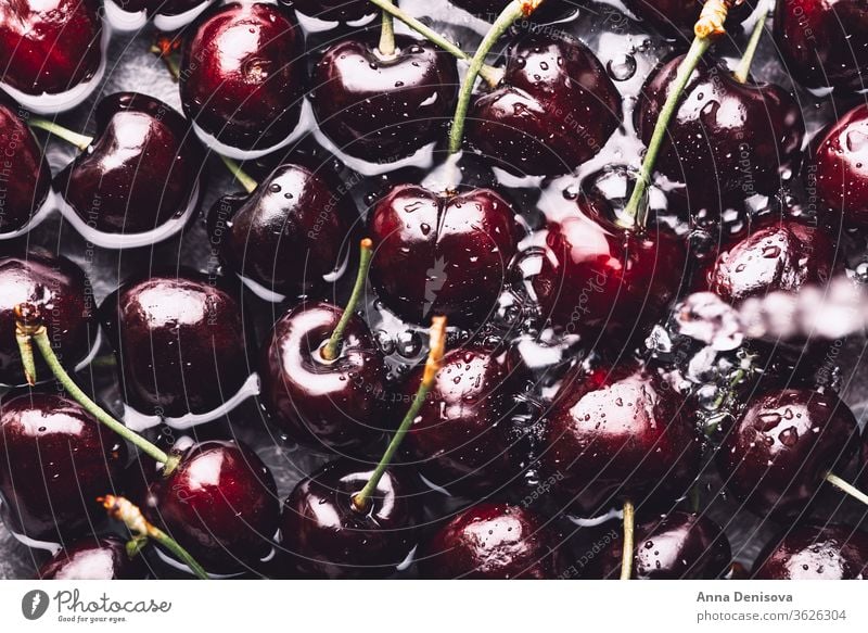 Macro of Fresh cherries raspberry cherry summer raspberries ripe delicious wash wet water nutrition tasty diet red food sweet nutritious garden macro top view