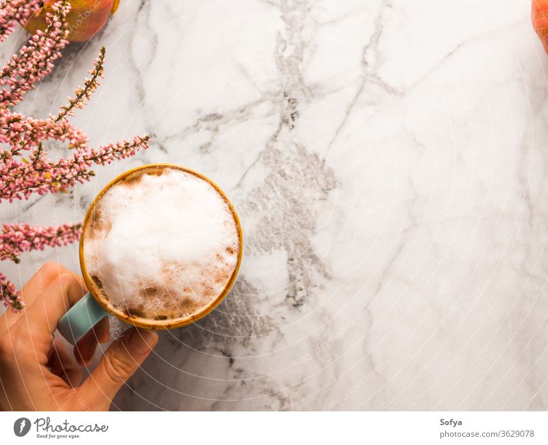 Autumn flat lay with mug of latte coffee on marble autumn background christmas woman food winter above light milk moody morning october november pumpkin relax
