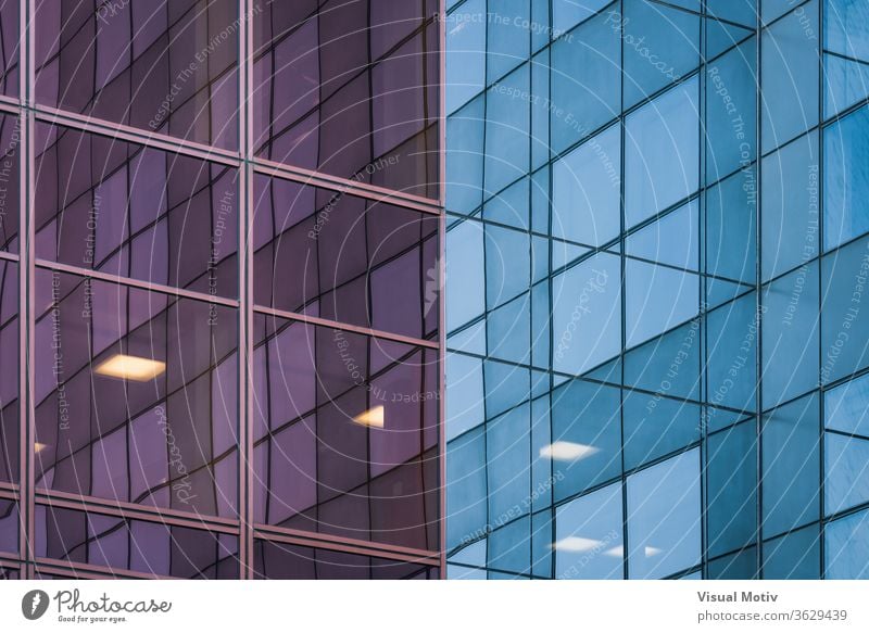 Reflections on the corner of the glass facade of an office building reflection evening exterior modern reflective mirror construction contemporary urban city