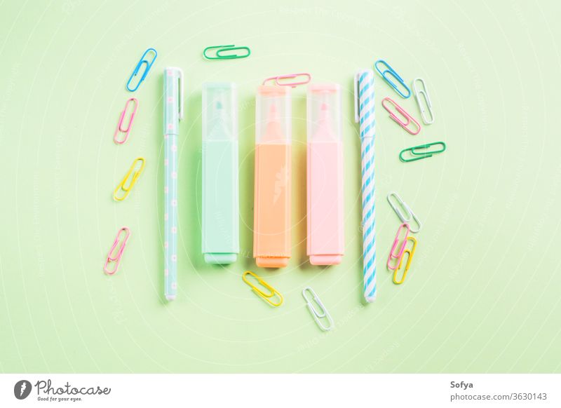 Pastel color flat lay with trendy stationery pastel green back school colorful highlighters clips blogging writing concept blank workspace mint write create