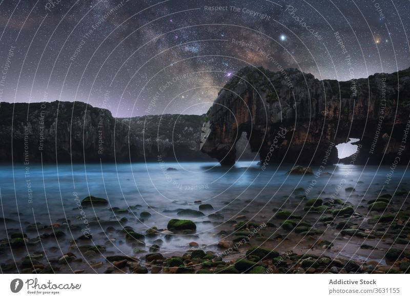 Night landscape with rocky coast and Milky Way cliff milky way night rough wild sea star dark sky nature shore ocean scenic tranquil stone picturesque coastline