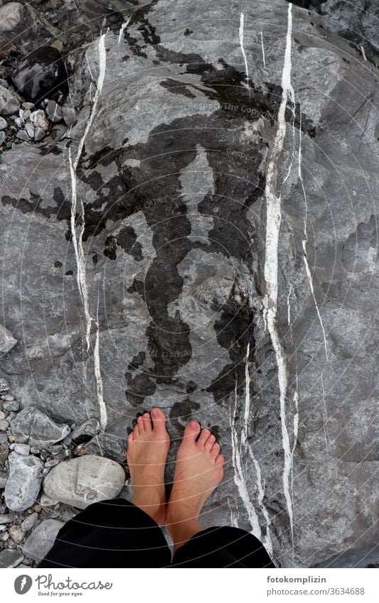 wet feet with footprints on rocks with white parallel lines Flowstone Line track search Tracks Stone stones Pebble dash White Parallel parallels Side by side