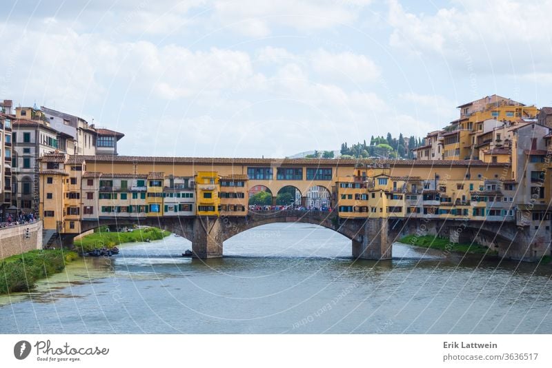 Iconic Vecchio Bridge in Florence over river Arno called Ponte Vecchio florence italy toscana firenze tuscany architecture vecchio city italian travel cityscape