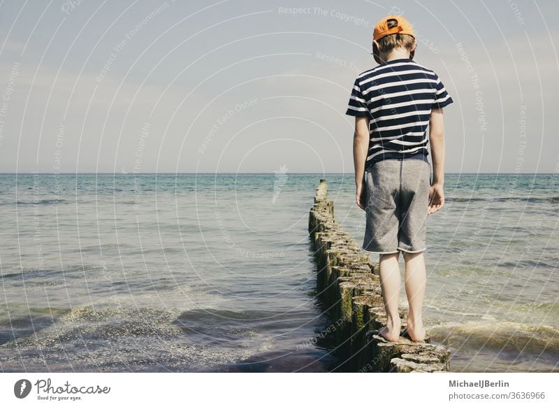 young boy and the ocean - a Royalty Free Stock Photo from Photocase