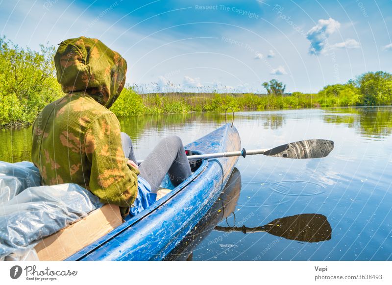 Couple at kayak trip on blue river man people water canoe nature tree forest cloud calm sky travel landscape green summer view outdoor beautiful natural