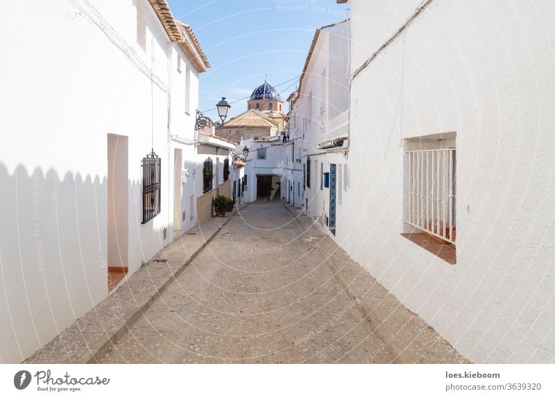 Narrow medieval road to the blue domed church in the old town of Altea, Costa Blanca, Spain Alley travel Street Town Church Mediterranean Destination Dome