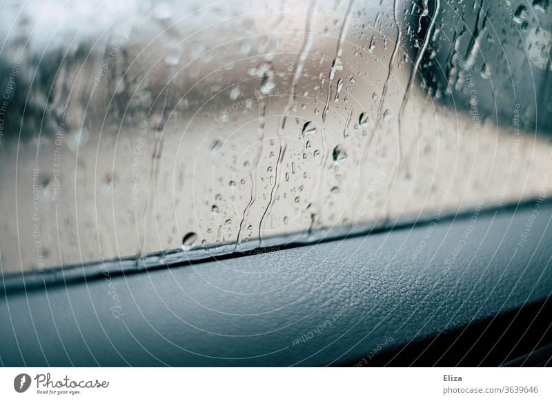 View from the car window in the rain Car Window Rain raindrops Window pane Bad weather Vehicle Wet Autumn Motoring Weather Drops of water Detail