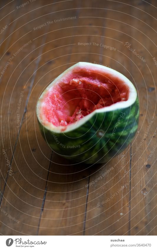 hollowed out melon on a wooden floor Derby Water melon fruit salubriously Delicious Eaten Concave Fruit flesh inboard Juicy Healthy Eating Thirst-quencher