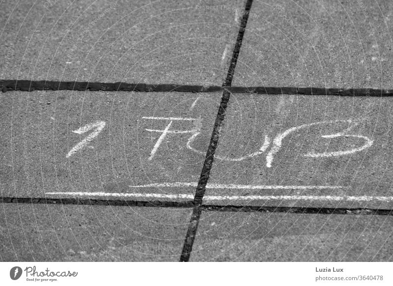 Chalk writing on the sidewalk, 1 foot and further hopscotch Chalk drawing Sidewalk Children's game Town urban Black & white photo lines Playing Exterior shot
