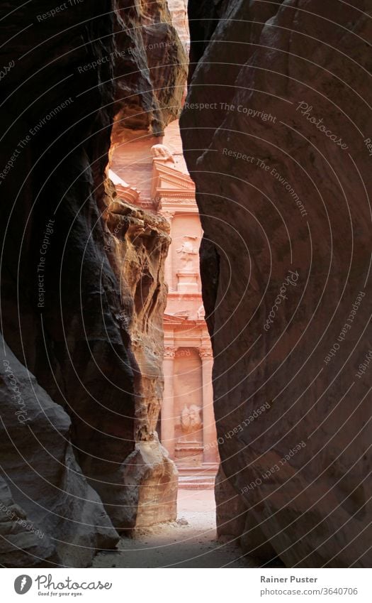 A glimpse of the treasury in Petra, Jordan adventure ancient antique arab arabian arabic archeology architecture building canyon carved civilization culture
