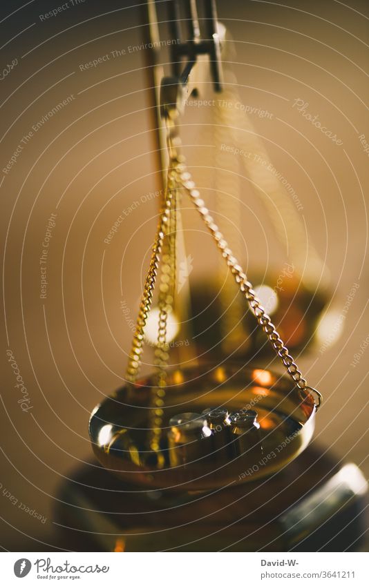 Brass balance with weights oscillates until it displays the result Scale Time Money concept Balance Weight Fairness Honest Justice judiciary Lady Justice Detail