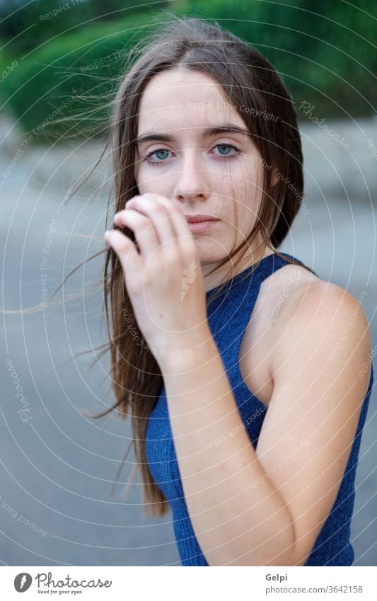 Cute teenager girl with long and straight hair - a Royalty Free