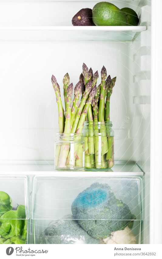 Flavoursome, sweet and tender British asparagus in the fridge fresh green white raw natural british season avocado salad detox diet bunch food spring healthy