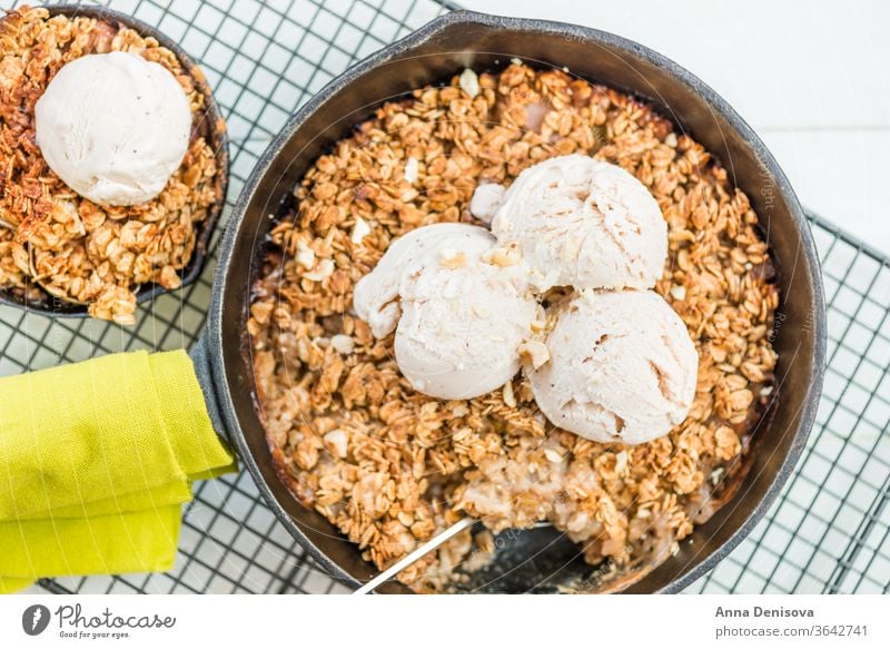 Homemade cooked rhubarb and apple crumble with oatmeal and vanil berry healthy fruit cake ice cream vanilla cobbler food strawberry wooden pan sweet dessert