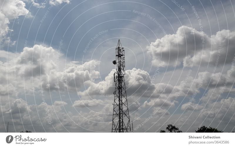 Telecommunication tower with blue sky and fluffy white clouds abstract background. Copy space nature and environment concepts. Wireless Equipment Electrical