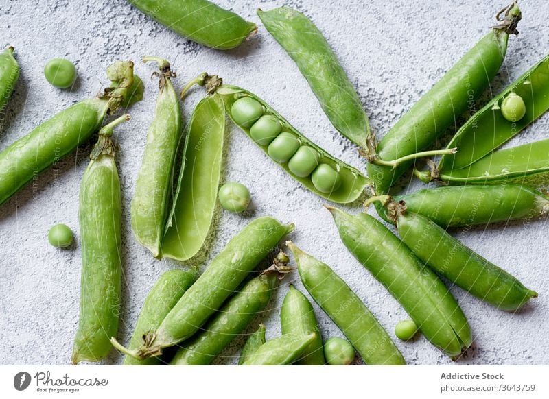 Top view image of sweet peas with opened pod green vegetable organic food produce harvest vegan diet ingredient healthy nutrition spring vitamin legume cooking
