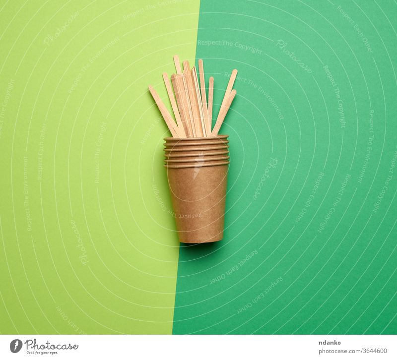 disposable empty cups of brown craft paper and wooden sticks dishware drink fast flat background beverage blank cardboard closeup coffee color conceptual