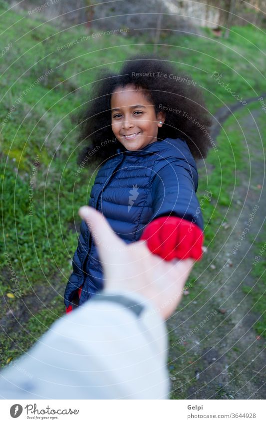 African little girl shakig hands with somebody person afro hair long brunette aid care people african family shake hands guide portrait happy american child
