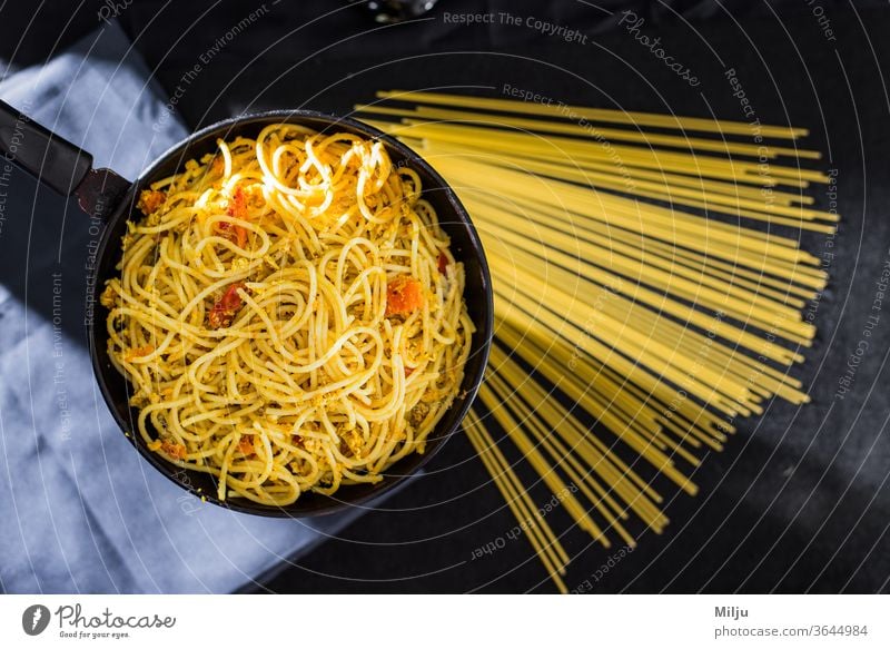 Cooked Spaghetti With Fried Eggs in fry pan pasta spaghetti food italian meal plate cuisine dinner noodles cooking dish healthy isolated macaroni ingredient