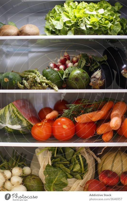 Various healthy food on shelves in fridge kitchen vegetable fruit grocery delicious organic assorted vitamin ripe home nutrition various shelf ingredient modern