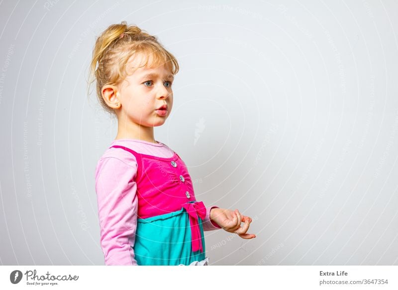 Portrait of sweet little girl as she is have comical face expression Adorable Amusing Carefree Careless Caucasian Cheerful Child Childhood Comical Crazy Cute