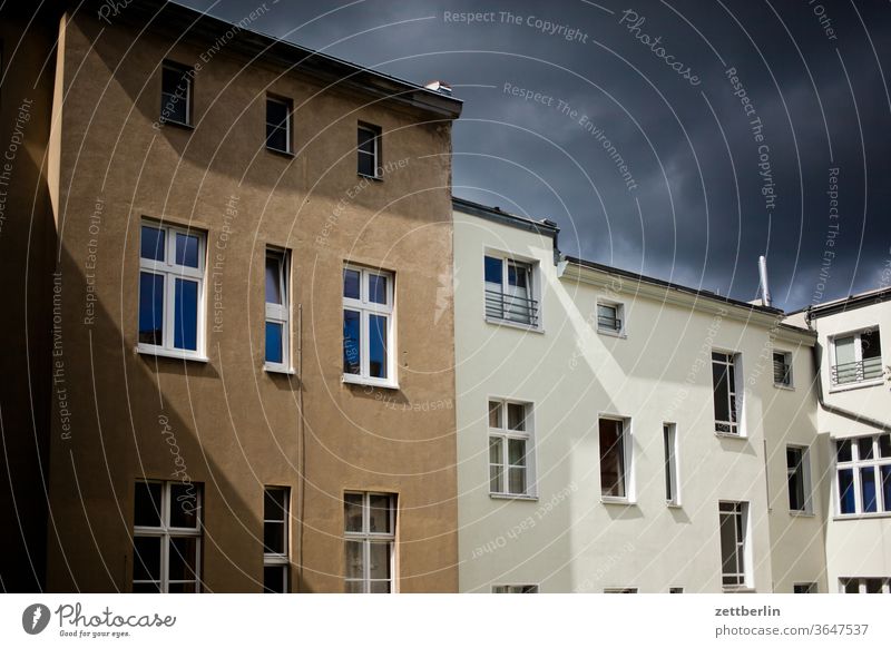 Facade with clouds and sun Old building on the outside Fire wall Window House (Residential Structure) Sky Sky blue rear building Backyard Courtyard