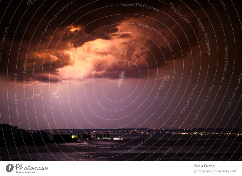 A thunderstorm over the Bodensee provides for a beautiful play Thunder and lightning Lake Constance lightning bolt Clouds Water Gale Storm Idyll Nature