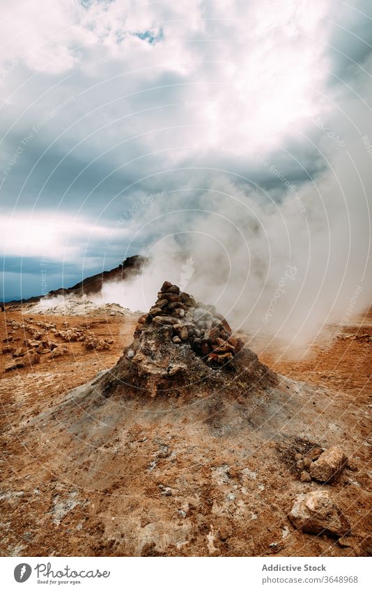 Geothermal area with rocks and mountains hverir geothermal landscape terrain vapor steam majestic iceland cloudy nature scenic stone environment rough wild