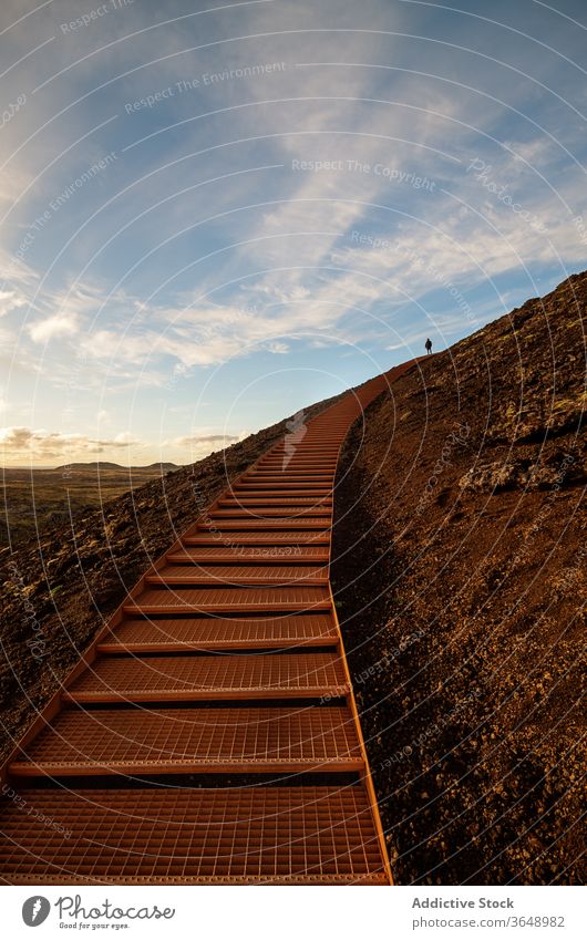Metal trail in mountainous terrain highland footpath picturesque sunset metal step stair landscape nature evening summer scenic tranquil way dusk sundown