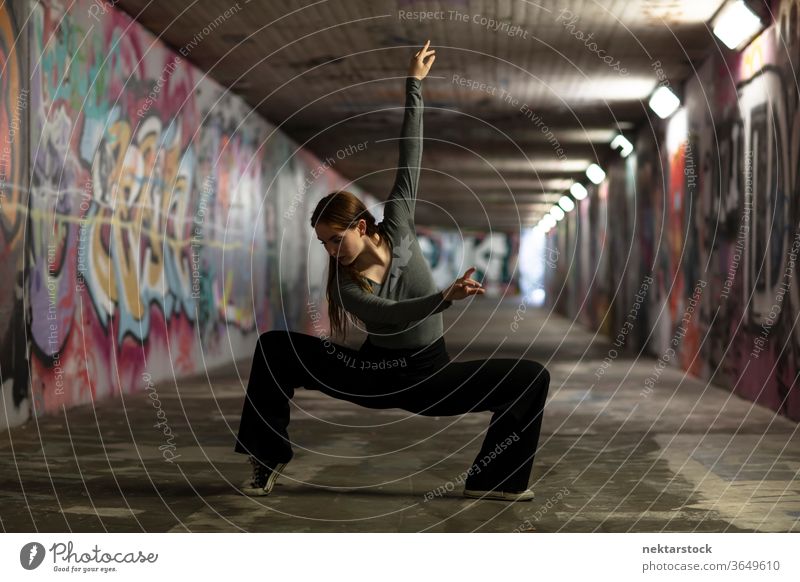 Modern Dancer Pose in City Tunnel Dancing dancer girl young woman performing arts ballet modern dance contemporary dance dance pose dance moves street performer
