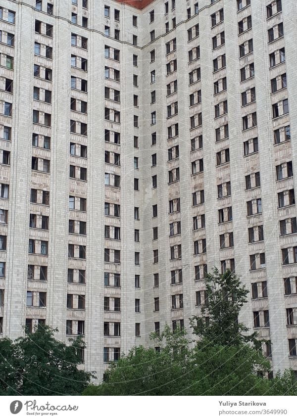 Dormitory of Moscow State University. Tall block of flats with gray walls and windows. Living apartments building architecture background. accommodation