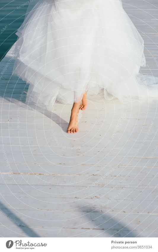 bride's bare feet as a symbol of innocence and simple joys of life barefoot wedding white engagement freedom Wedding Bride Bride groom Love