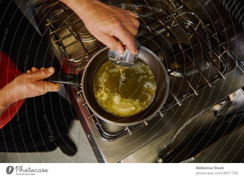 https://www.photocase.com/photos/3651730-crop-unrecognizable-cook-pouring-olive-oil-into-frying-pan-photocase-stock-photo-large.jpeg