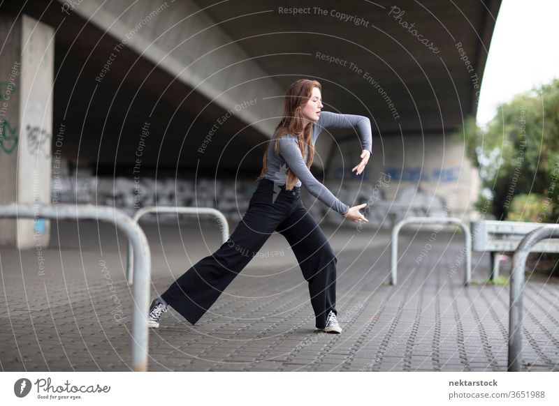 Street Dancer in Motion on Sidewalk female dancer modern dance street dance sidewalk one person girl young woman caucasian ethnicity youth culture full length