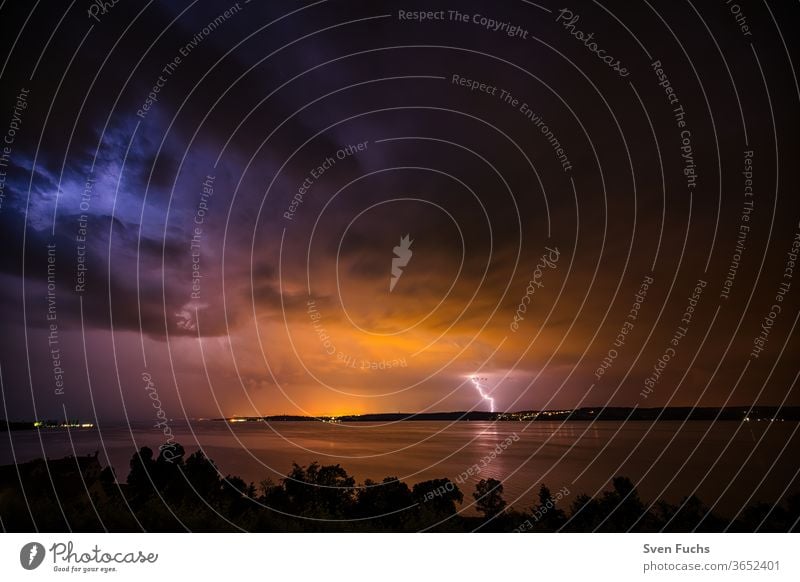 A thunderstorm over the Bodensee provides for a beautiful play Thunder and lightning Lake Constance lightning bolt Clouds Water Gale Storm Idyll Nature